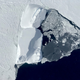An iceberg surrounded by sea ice just north of Venable Ice Shelf in West Antarctica. Photo: NASA/Nathan Kurtz